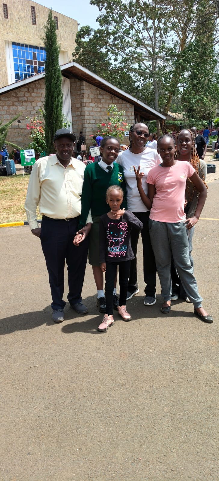 Rev. Irene with family members outside a church